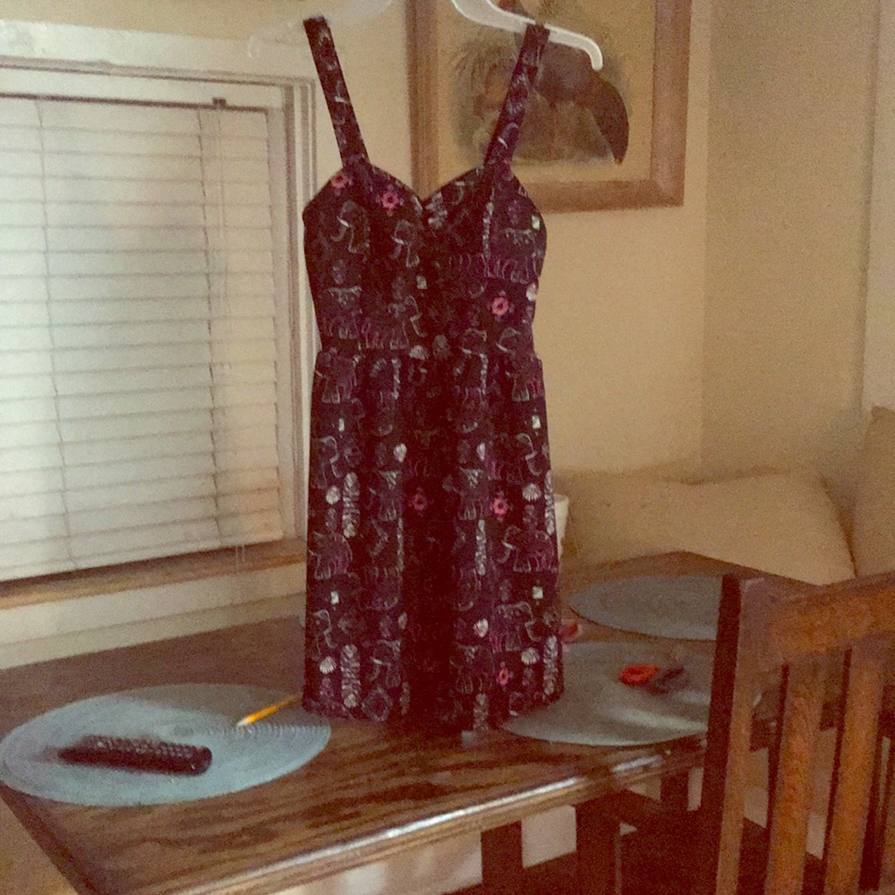 A black dress with elephant and flower pattern